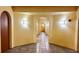 Building hallway with arched doorways and tiled floors at 99 Vivante Blvd # 99315, Punta Gorda, FL 33950
