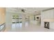 Open concept living area with modern fireplace and sliding glass doors at 1010 Acadia Rd, Venice, FL 34293