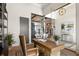 Bright home office with built-in shelving and a large desk at 1018 Blue Shell Loop, Sarasota, FL 34240
