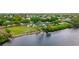 Aerial view of community with pool, tennis courts, and waterfront access at 1228 50Th E St, Bradenton, FL 34208