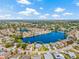 Expansive aerial view featuring waterfront home with lush landscaping and community setting at 1228 50Th E St, Bradenton, FL 34208