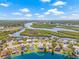 Aerial shot showcasing backyard pool, waterfront views, and tranquil surroundings at 1228 50Th E St, Bradenton, FL 34208