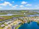 Beautiful aerial view of waterfront home with a pool in Bradenton, Florida, located on a peaceful canal at 1228 50Th E St, Bradenton, FL 34208