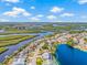 Aerial view highlighting waterfront property with lush landscaping and serene lake views at 1228 50Th E St, Bradenton, FL 34208