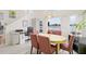 Bright dining area with round table and lake view at 1228 50Th E St, Bradenton, FL 34208