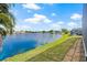 Scenic lake view with lush green grass and blue water at 1228 50Th E St, Bradenton, FL 34208