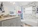 Stylish bathroom featuring granite counters, tiled shower, modern fixtures and a large vanity at 1228 50Th E St, Bradenton, FL 34208
