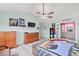 Spacious bedroom featuring gray laminate floor, ceiling fan, and access to the Primary bathroom at 1228 50Th E St, Bradenton, FL 34208