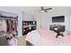 Cozy bedroom featuring a ceiling fan, closet and tv at 1228 50Th E St, Bradenton, FL 34208