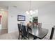 Nicely decorated dining room featuring stylish furniture and a modern chandelier at 1228 50Th E St, Bradenton, FL 34208
