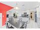 Modern kitchen featuring white cabinets, granite countertops, and a mosaic backsplash at 1228 50Th E St, Bradenton, FL 34208