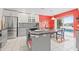 Stylish kitchen with stainless appliances, granite countertops, and a view of the pool at 1228 50Th E St, Bradenton, FL 34208