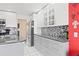 Contemporary kitchen with granite countertops, mosaic backsplash, and stainless steel appliances at 1228 50Th E St, Bradenton, FL 34208
