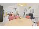 Spacious living room featuring vaulted ceilings, a modern ceiling fan, and lots of natural light at 1228 50Th E St, Bradenton, FL 34208