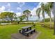 Enjoy outdoor dining at the community picnic area, featuring a table, grill, and serene water views at 1228 50Th E St, Bradenton, FL 34208