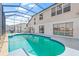 Spacious screened-in pool with views of the home and lake at 1228 50Th E St, Bradenton, FL 34208