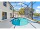 Screened pool with lake view and patio at 1228 50Th E St, Bradenton, FL 34208