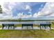 Scenic water view from community benches on a sunny day, perfect for relaxation and enjoying the outdoors at 1228 50Th E St, Bradenton, FL 34208
