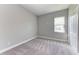 Simple bedroom with carpet and neutral walls at 12389 Cedar Pass Trl, Parrish, FL 34219