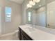 Bathroom with vanity, sink, and shower at 12389 Cedar Pass Trl, Parrish, FL 34219