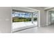 View of the pool and backyard through sliding doors at 12389 Cedar Pass Trl, Parrish, FL 34219