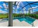 L shaped pool with waterfall feature and screen enclosure at 12389 Cedar Pass Trl, Parrish, FL 34219