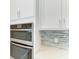 Stainless steel wall oven and microwave combo in a modern kitchen at 12389 Cedar Pass Trl, Parrish, FL 34219