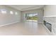 Spacious living room featuring a fireplace and view of the backyard at 12389 Cedar Pass Trl, Parrish, FL 34219