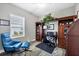 Home office with built-in wooden shelving and seating at 12741 Coastal Breeze Way, Bradenton, FL 34211