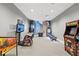 Game room featuring various arcade games and seating at 15511 Sunny Day Dr, Lakewood Ranch, FL 34211