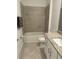 Bathroom with granite vanity, tiled shower and tub at 15511 Sunny Day Dr, Lakewood Ranch, FL 34211