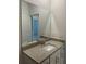 Modern bathroom with granite countertop and large mirror at 15511 Sunny Day Dr, Lakewood Ranch, FL 34211