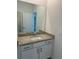 Bathroom with granite countertop, sink, and mirror at 15511 Sunny Day Dr, Lakewood Ranch, FL 34211