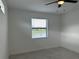 Simple bedroom with tile flooring and window blinds at 15511 Sunny Day Dr, Lakewood Ranch, FL 34211