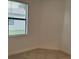 Empty bedroom with neutral walls and tiled floors at 15511 Sunny Day Dr, Lakewood Ranch, FL 34211