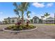 Community center with palm trees and landscaped grounds at 15511 Sunny Day Dr, Lakewood Ranch, FL 34211