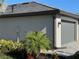Gray house exterior with garage and landscaping at 15511 Sunny Day Dr, Lakewood Ranch, FL 34211
