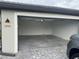 Spacious garage with overhead door open at 15511 Sunny Day Dr, Lakewood Ranch, FL 34211