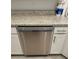 Stainless steel dishwasher in modern kitchen with granite countertops at 15511 Sunny Day Dr, Lakewood Ranch, FL 34211