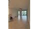 Bright and airy living room with tile flooring and sliding glass doors at 15511 Sunny Day Dr, Lakewood Ranch, FL 34211