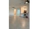 Open living room with tile floors and ceiling fans at 15511 Sunny Day Dr, Lakewood Ranch, FL 34211