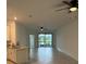 Open concept living room and kitchen area with tile flooring at 15511 Sunny Day Dr, Lakewood Ranch, FL 34211