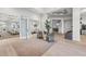Elegant lobby with seating area and access to dining room at 15511 Sunny Day Dr, Lakewood Ranch, FL 34211