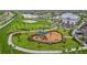 Aerial view of community park with playground and clubhouse at 15511 Sunny Day Dr, Lakewood Ranch, FL 34211