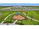 Community playground with swings, slides, and other play equipment at 15511 Sunny Day Dr, Lakewood Ranch, FL 34211