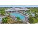 Resort-style pool with plenty of lounge chairs and umbrellas at 15511 Sunny Day Dr, Lakewood Ranch, FL 34211