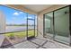 Screened porch with pond view in the distance at 15511 Sunny Day Dr, Lakewood Ranch, FL 34211