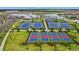 Community tennis and pickleball courts with green landscaping at 15511 Sunny Day Dr, Lakewood Ranch, FL 34211