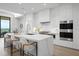 Modern kitchen with white cabinets and island, stainless steel appliances at 1591 Gulf Of Mexico Dr # 515, Longboat Key, FL 34228