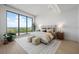 Spacious bedroom with large windows and water view at 1591 Gulf Of Mexico Dr # 515, Longboat Key, FL 34228